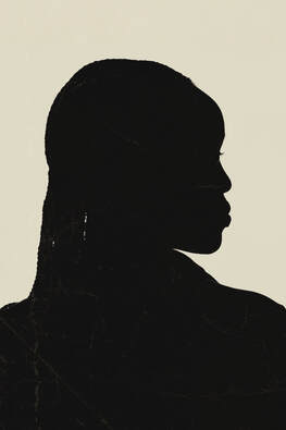 A sillouette of a Black woman turning around